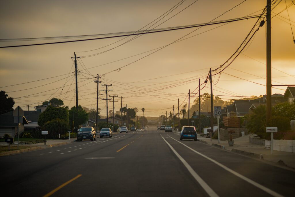 a-sunset-road-to-the-ocean-cable-wires-communic-2024-12-04-14-52-56-utc